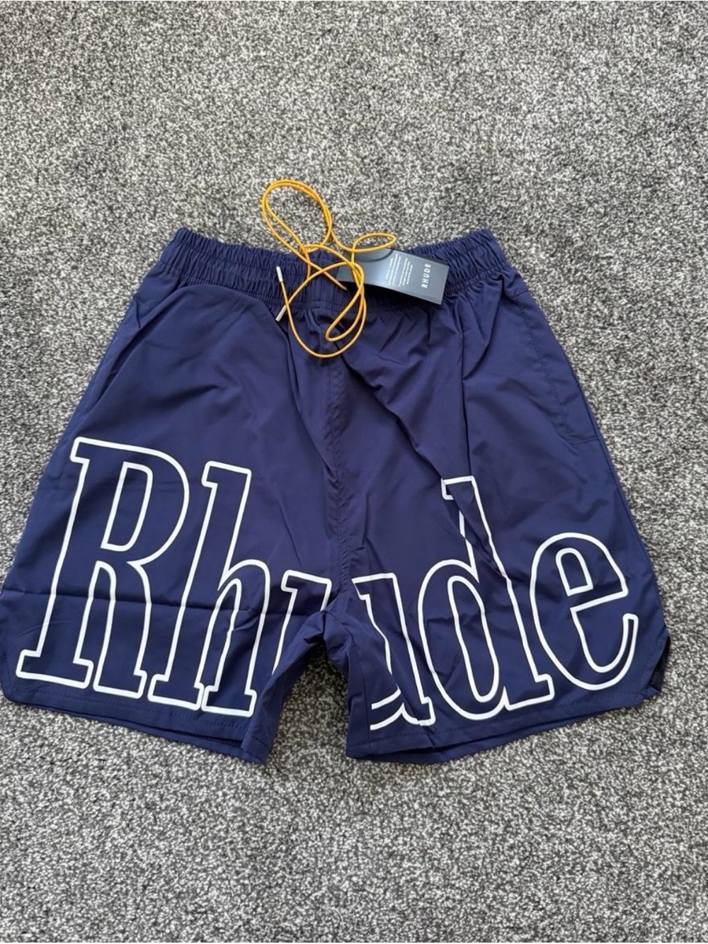 Rhude Navy Shorts with White Outline Logo and Yellow Drawcord